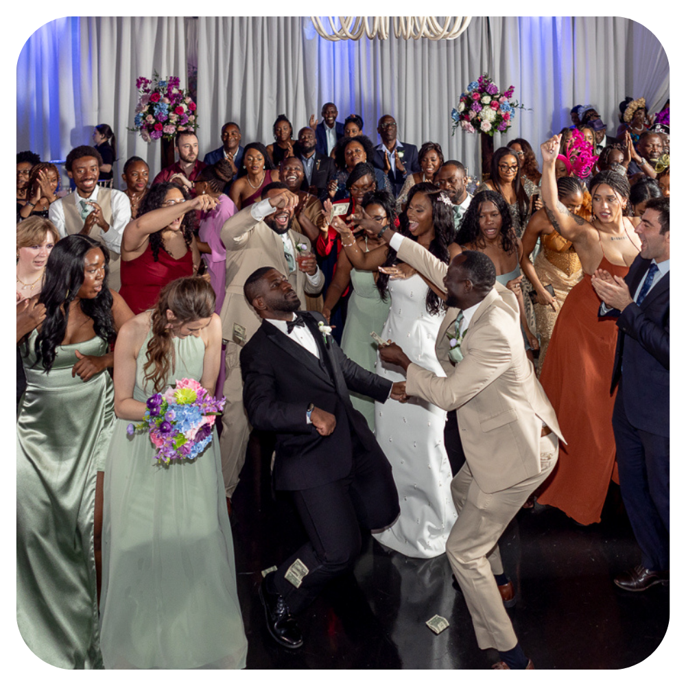 Packed dance floor with bride singing along at wedding