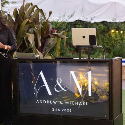 Customized DJ booth with Andrew & Michael monogram display by Xpress Entertainment at Villa Toscana Miami wedding.